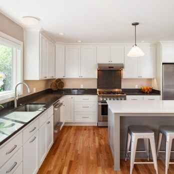 WL Construction - a clean kitchen with white cabinets and black countertops - General Contractors Near Me - Corvallis, Oregon WL Construction - a clean kitchen with white cabinets and black countertops - General Contractors Near Me - Corvallis, Oregon