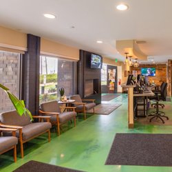 Lightshade Rec & Med Dispensary - Modern waiting area inside Lightshade Dayton dispensary with seating, large windows, and a reception desk.