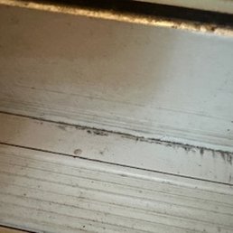 Screwdriver scrapes on the threshold and warping at the bottom of the door. Screwdriver scrapes on the threshold and warping at the bottom of the door.