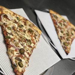 Village Pizzeria & Grill - 14inch Pizza by the slice $3.99 + .50 cents per topping