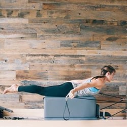 Allure Pilates - Pulling Straps on reformer targets the upper back.