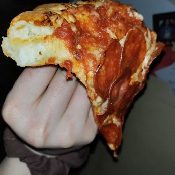 Little Caesars - a hand holding a slice of pizza - Pizza Near Me - Henderson, Nevada Little Caesars - a hand holding a slice of pizza - Pizza Near Me - Henderson, Nevada
