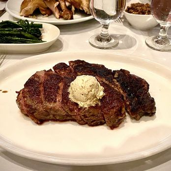 Nineteen 61 - Delmonico Steak and Smoked Broccolini - A 24 oz. Hand-cut Ribeye with Caramelized Onion Butter. Worth the Price. - Latin American Near Me - Lakeland, Florida Nineteen 61 - Delmonico Steak and Smoked Broccolini - A 24 oz. Hand-cut Ribeye with Caramelized Onion Butter. Worth the Price. - Latin American Near Me - Lakeland, Florida