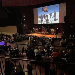 Stargazers Theatre and Event Center - Stage with tables and chairs