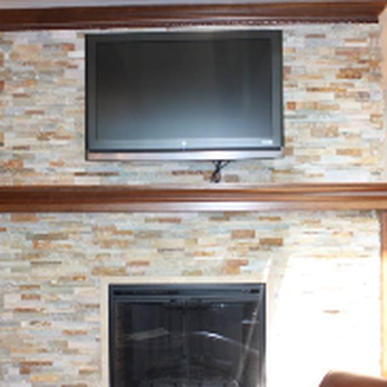 Master Carpentry Services - a fireplace with a flat screen tv - Flooring Near Me - Fargo, North Dakota Master Carpentry Services - a fireplace with a flat screen tv - Flooring Near Me - Fargo, North Dakota