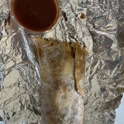 Chicharroland - 1/2 eaten Chorizo and Egg breakfast Burrito
