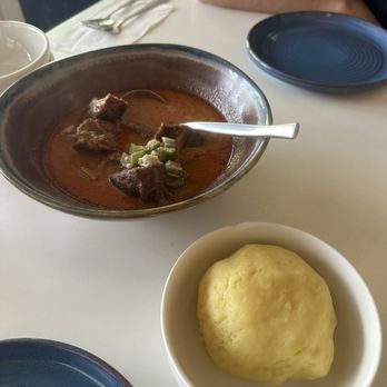 Gold Coast Ghal Kitchen - Goat peanut soup with fufu - African Near Me - Seattle, Washington Gold Coast Ghal Kitchen - Goat peanut soup with fufu - African Near Me - Seattle, Washington