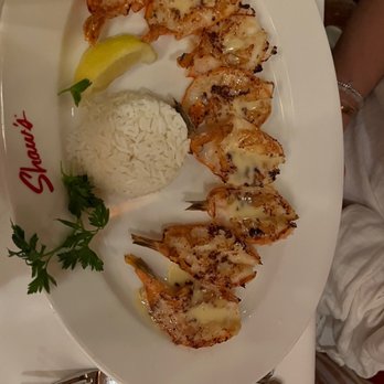 Shaw's Crab House - Griddled Garlic Shrimp - the shrimp are smashed with the skins on. The seasoning is all on the skin. - Seafood Near Me - Chicago, Illinois