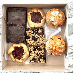 Upper Crust Cafe & Bakery - A box of assorted desserts.