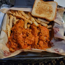 Huey Magoos - 5 piece Buffalo sauced chicken tenders with fries and Texas toast