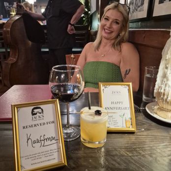 Jacks Chophouse - My beautiful partner with our drinks and table plaques - Steakhouses Near Me - Fredericksburg, Texas