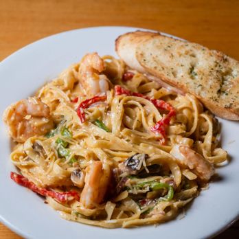 John's Pizza Works - a plate of pasta with shrimp and vegetables - Pizza Near Me - Mammoth Lakes, California John's Pizza Works - a plate of pasta with shrimp and vegetables - Pizza Near Me - Mammoth Lakes, California