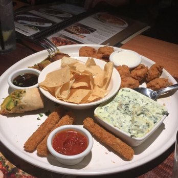 BJ's Restaurant & Brewhouse - App platter: spring rolls, mozzarella sticks, spinach dip, and wings - Breweries Near Me - Mobile, Alabama