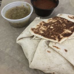 Crunchwrap with fire sauce and salsa verde