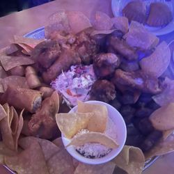 Islas Del Caribe Restaurant - Picadera, includes beef, pork, chicken, yuca frita, chorizo, tostones, cabbage salad, been dip.