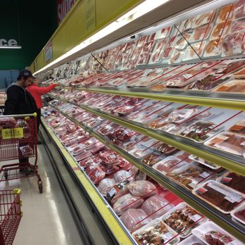 Super C - a woman shopping in a grocery store - Grocery Near Me - Mont-Tremblant, Quebec Super C - a woman shopping in a grocery store - Grocery Near Me - Mont-Tremblant, Quebec