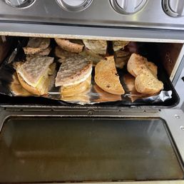 Personally toasting and having to heat up our breakfast sandwiches.