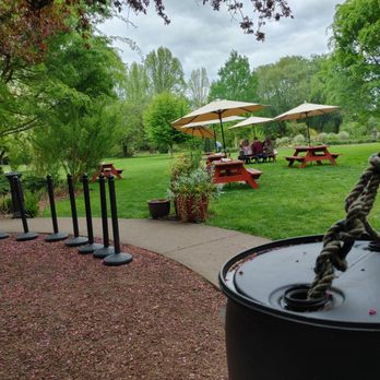 McMenamins Pat's Corner - a picnic area with tables and umbrellas - American Near Me - Forest Grove, Oregon