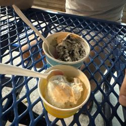 Ice Cream Station - Toasted coconut and cookies and cream yellow cup is one scoop