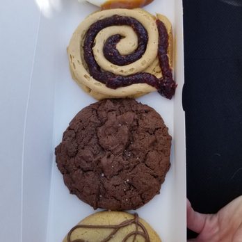 Crumbl - Morrisville - Top to bottom: Salted Caramel Cheesecake, Peanut Butter & Jelly, Dark Dream, Nutella Sea Salt - Bakeries Near Me - Morrisville, North Carolina Crumbl - Morrisville - Top to bottom: Salted Caramel Cheesecake, Peanut Butter & Jelly, Dark Dream, Nutella Sea Salt - Bakeries Near Me - Morrisville, North Carolina