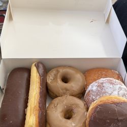 D K's Donuts - Chocolate bars, maple round, and jelly filled.