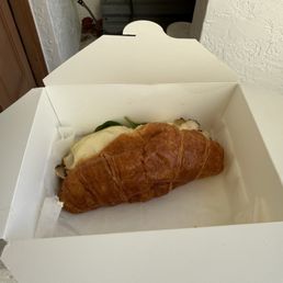 Huge croissant club sandwich.