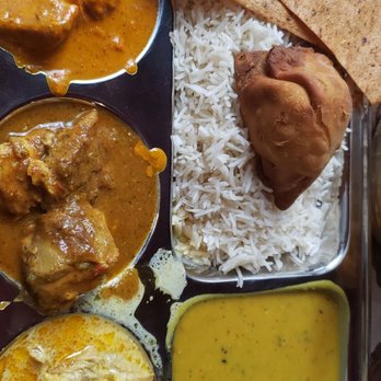 Indian Cuisine - $15.99 Non veg Thali. Butter chicken, chicken vindaloo, and chicken korma. A full basket of naan, small tasting of rice pudding - Indian Near Me - Gainesville, Florida Indian Cuisine - $15.99 Non veg Thali. Butter chicken, chicken vindaloo, and chicken korma. A full basket of naan, small tasting of rice pudding - Indian Near Me - Gainesville, Florida