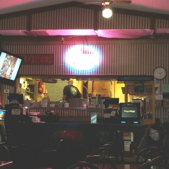 Roma Pizzeria & Restaurant - a woman sitting at the bar - Pizza Near Me - Flint, Michigan Roma Pizzeria & Restaurant - a woman sitting at the bar - Pizza Near Me - Flint, Michigan