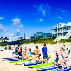Surf City Surf School - Age is a number that no one cares about. Here's there generations of TI visitors perfecting their pop-up.