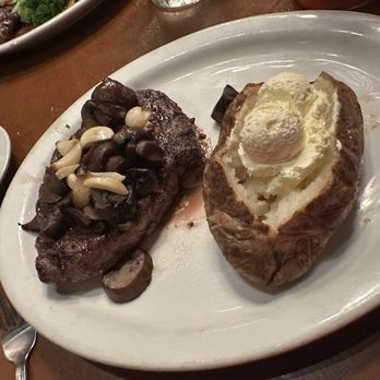Cool Hand Luke's - Ribeye (medium rare) with baked potato. - Steakhouses Near Me - Santa Maria, California