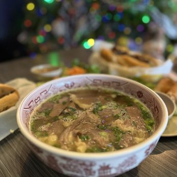 Pho Ben - Sugar Land - a bowl of soup and a plate of bread - Vietnamese Near Me - Sugar Land, Texas Pho Ben - Sugar Land - a bowl of soup and a plate of bread - Vietnamese Near Me - Sugar Land, Texas