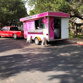 Taco Baby - a pink food truck parked in a parking lot - Food Trucks Near Me