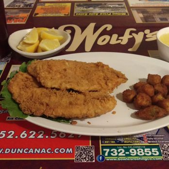 Wolfy's Restaurant - Fried Tilapia, cheese grits and deep fried okra, with lemon to squeeze on the fish and sweet tea! - American Near Me - Ocala, Florida