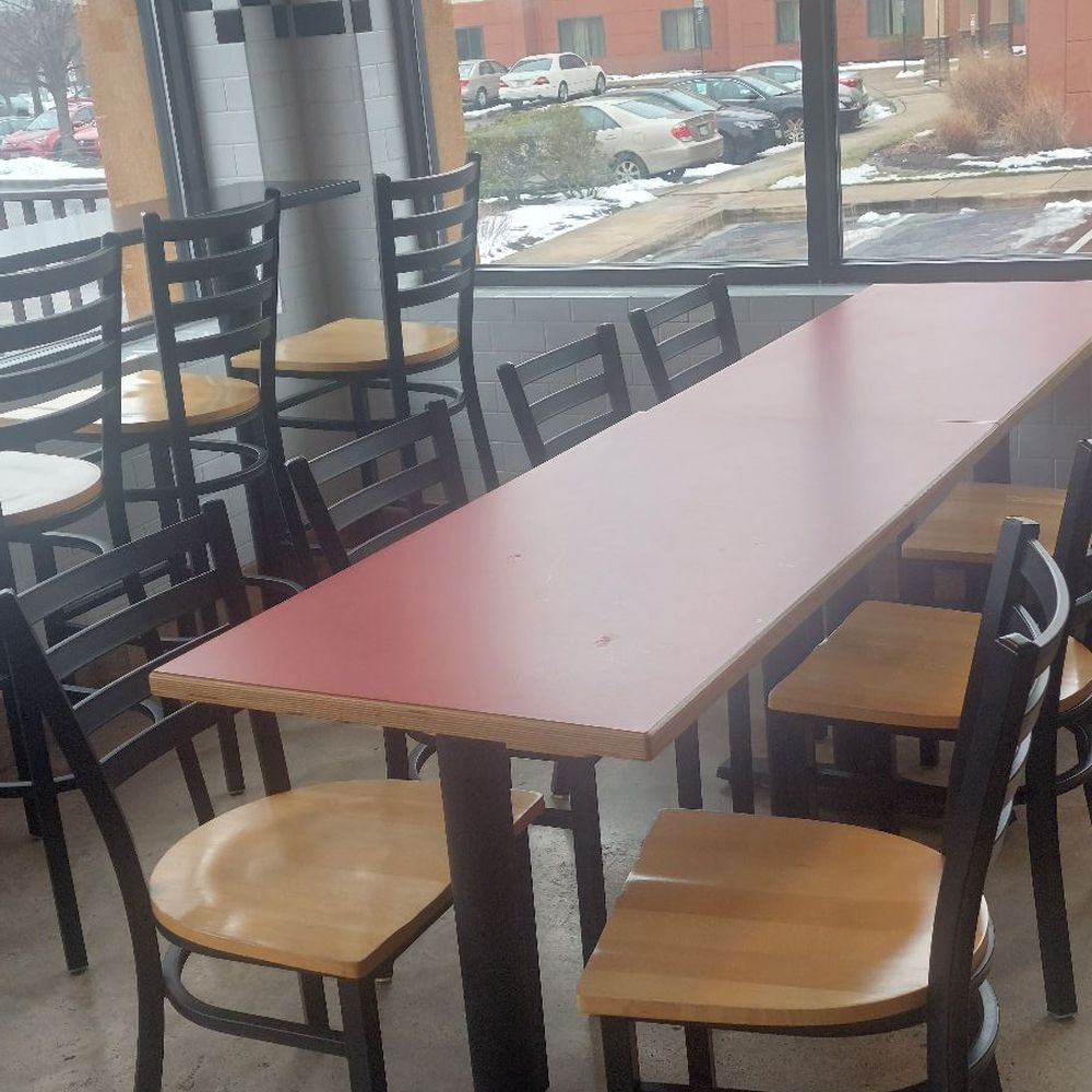 a table and chairs in a restaurant a table and chairs in a restaurant