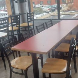 a table and chairs in a restaurant a table and chairs in a restaurant