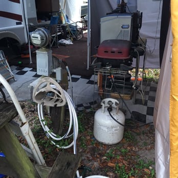 Nature's Resort - that's MY water and electric inside the next door neighbors tent. I guess that's where 1/2 of my oversized camping site was located? - RV Parks Near Me - Homosassa, Florida