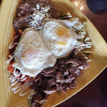 Kikey's Cafe - Chilaquiles divorciados (add carne asada). The red sauce is mild but flavorful, and the green packs some heat . - Breakfast & Brunch Near Me - Burien, Washington