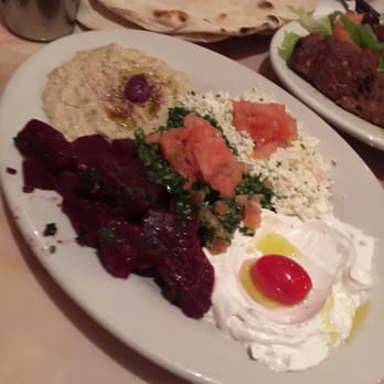 Bedouin Tent - Assorted salad plate with Merguez pictured off to the right side and amazing pita in the back. - Middle Eastern Near Me - Brooklyn, New York