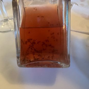 Maritime Grille - a bottle of sauce on a table - New American Near Me - Guilford, Connecticut