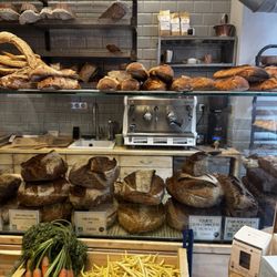 Mama Baker - Inside of the bakery with bread and produce
