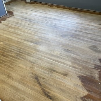 AK Hardwood Floors - First stage of refinishing in middle bedroom - Flooring Near Me