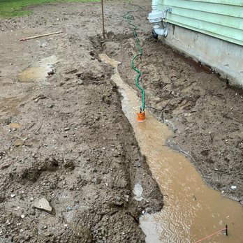 Dolce Vita Landscaping - Heavy rains the next day and no erosion control measure allowed it to run off right to the foundation. Their badly pitch trench. - Landscaping Near Me Dolce Vita Landscaping - Heavy rains the next day and no erosion control measure allowed it to run off right to the foundation. Their badly pitch trench. - Landscaping Near Me