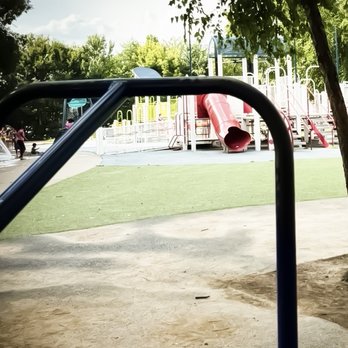 Adventure Playground - Get on Pat is pushing the merry go round. - Parks Near Me - Louisville, Kentucky