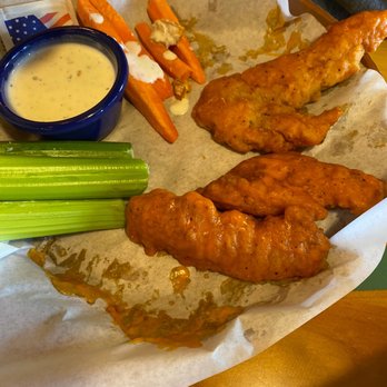 Islands Restaurant - Tiki Tenders tossed in Buffalo sauce - Burgers Near Me - Avondale, Arizona Islands Restaurant - Tiki Tenders tossed in Buffalo sauce - Burgers Near Me - Avondale, Arizona