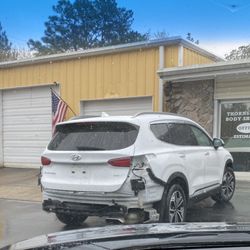 Pinehurst Hyundai - After it was knocked off the lift by a runaway golf cart. Total negligence of the dealership.