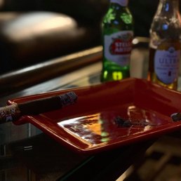 a cigar and a bottle of beer a cigar and a bottle of beer