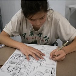 Venice Arts - Student zoning in as they work on the inking process of Comic-making
