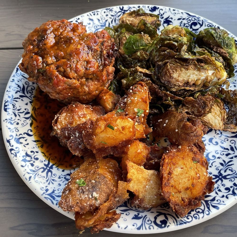 Tupelo Honey Southern Kitchen & Bar - Bourbon peppercorn glazed meatloaf w/Brussels sprouts and fried potatoes - Southern Near Me - Pittsburgh, Pennsylvania Tupelo Honey Southern Kitchen & Bar - Bourbon peppercorn glazed meatloaf w/Brussels sprouts and fried potatoes - Southern Near Me - Pittsburgh, Pennsylvania