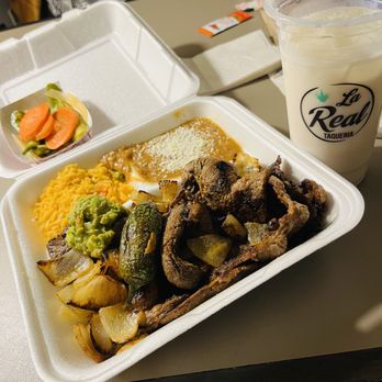 La Real - a tray of food and a drink on a table - Mexican Near Me - Portland, Oregon La Real - a tray of food and a drink on a table - Mexican Near Me - Portland, Oregon