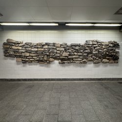 MTA - South Ferry Subway Station - South Ferry/Whitehall St Subway Station (1,R,W) - Embedded west face of Colonial-era Battery Wall discovered at this level 500 feet away